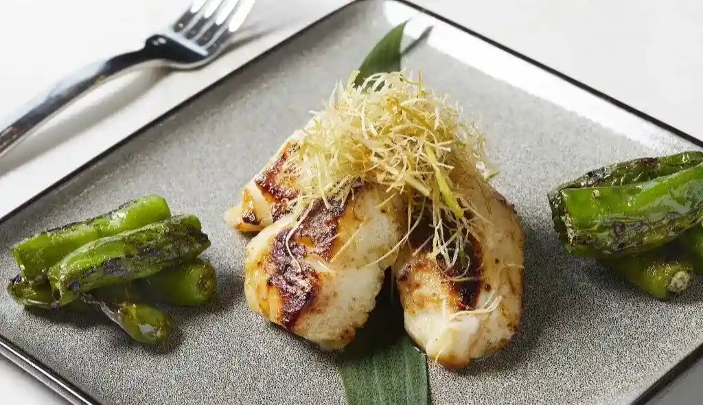 Grilled sea bass with shishito peppers at Wren